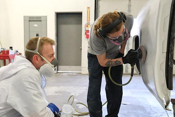 paint-tech-apprentice2 | Schaefer Autobody Centers Apprentice sands while journeyman watches